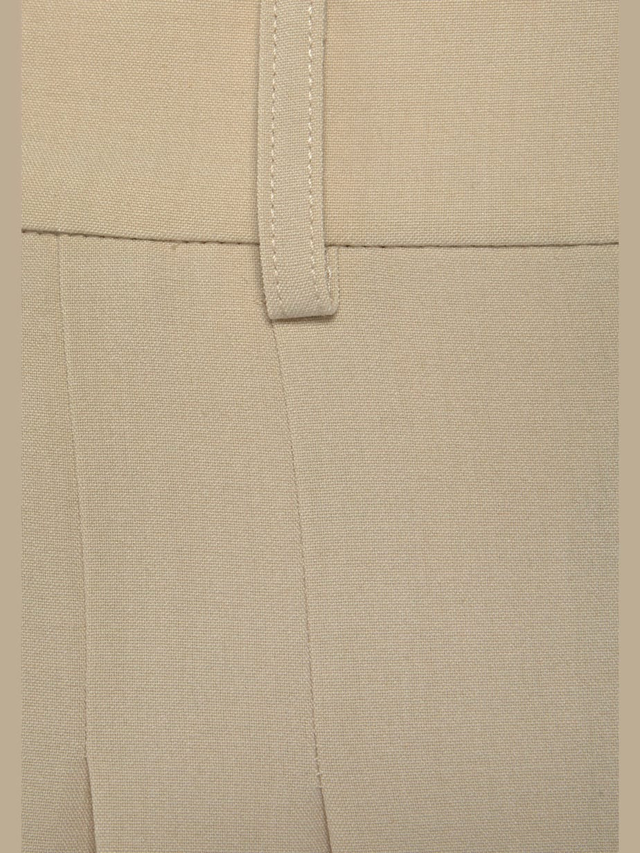 Pantalon large avec pinces et poches pratiques devant